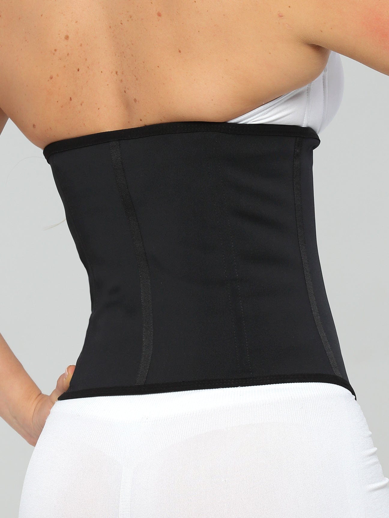 Black Colombian latex waist trainer with high compression, back view