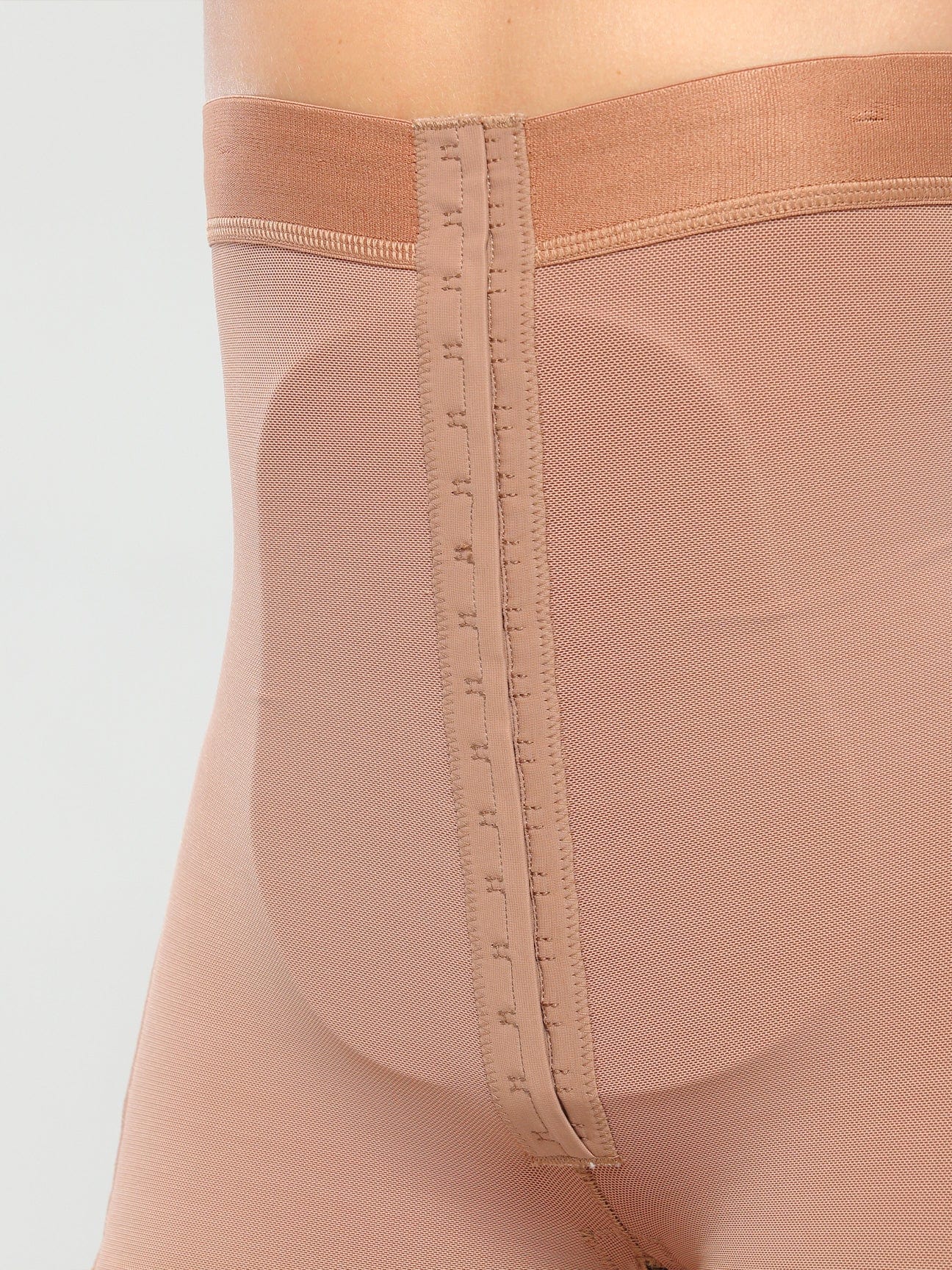 Post-surgical abdominal board insert worn inside high-waisted compression garment