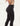 Waist view of a model wearing a black shapewear leggings with buttons.
