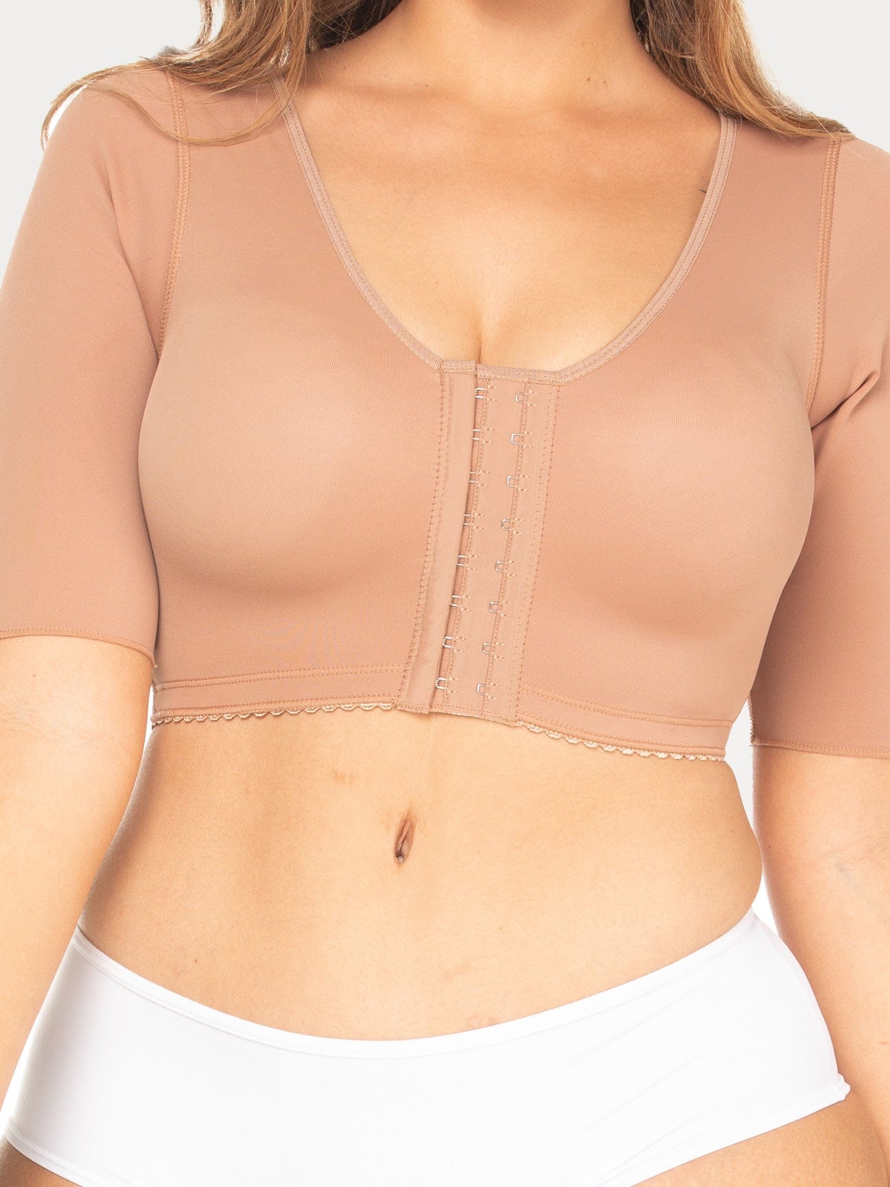 Mocha Colombian compression bra with hook-and-eye closure and sleeves for arm compression, front view