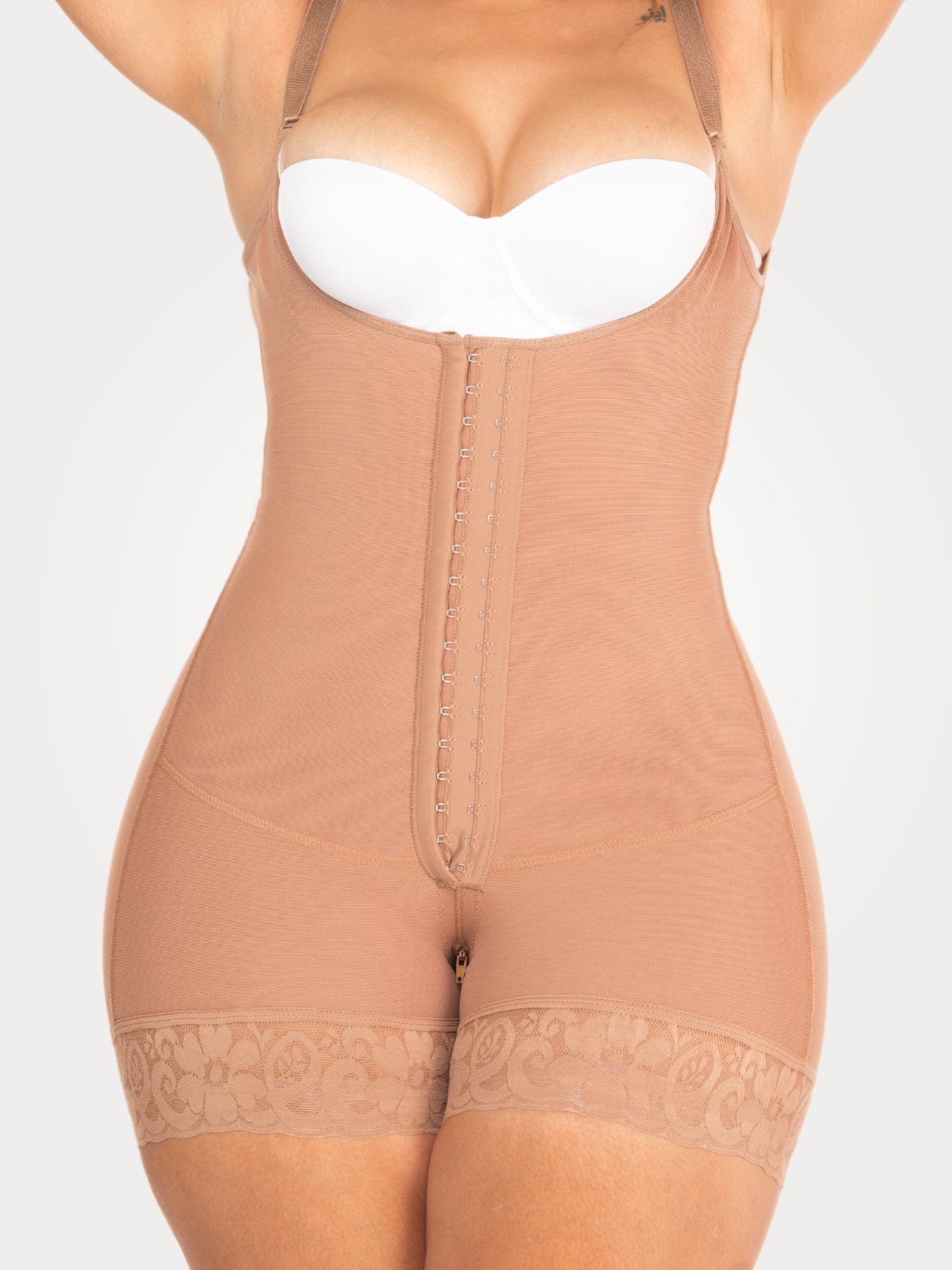Beige Colombian shapewear bodysuit with adjustable straps, hook-and-eye closure, and smoothing compression, front view