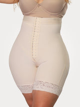 Beige Colombian high-waisted strapless faja with adjustable hook-and-eye closure, front view