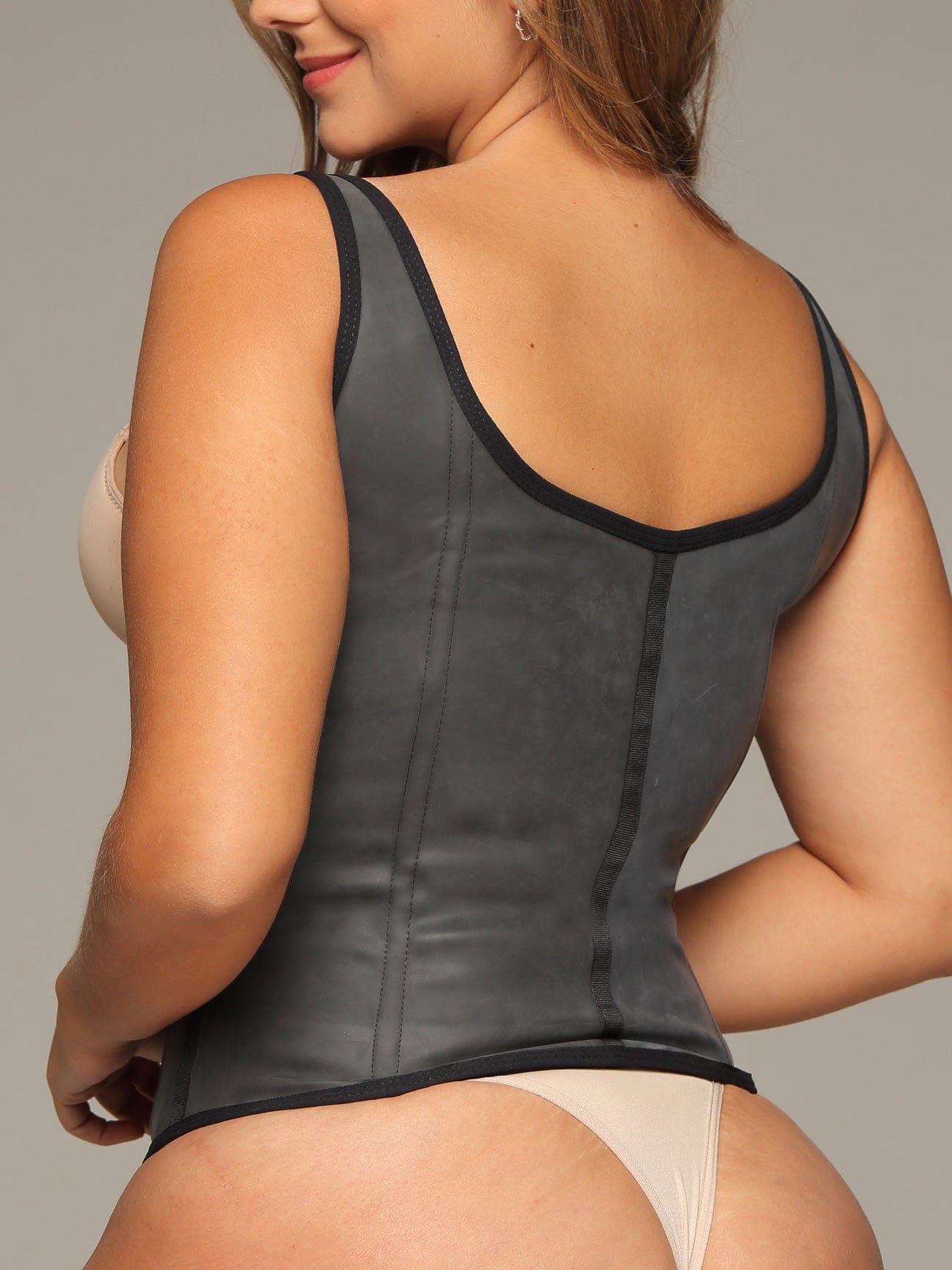 Black Colombian latex waist trainer with high compression, back view