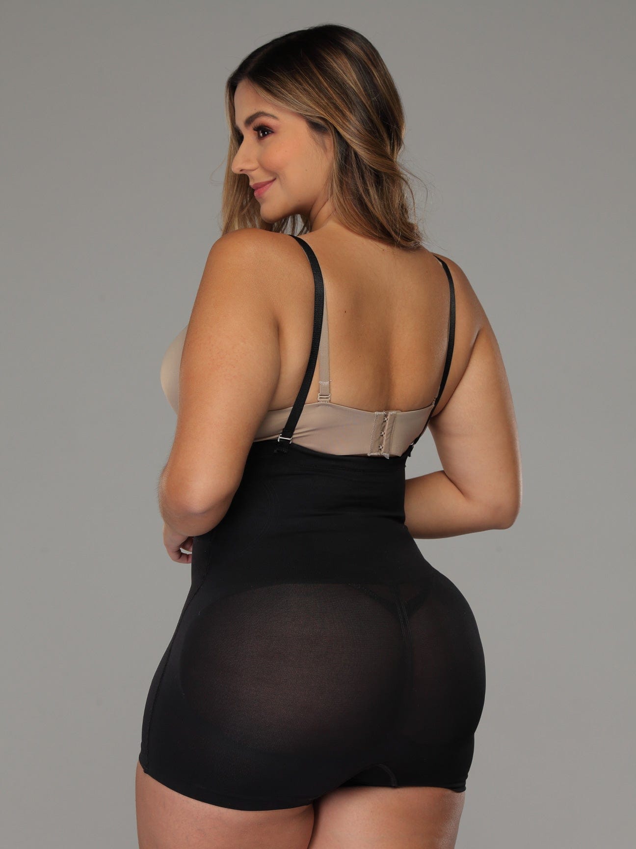 Black Colombian shapewear bodysuit with butt-lifting panels and light waist compression, back view
