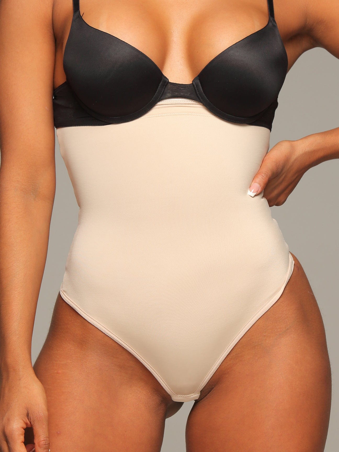 Beige Colombian strapless faja bodysuit with light compression, front view