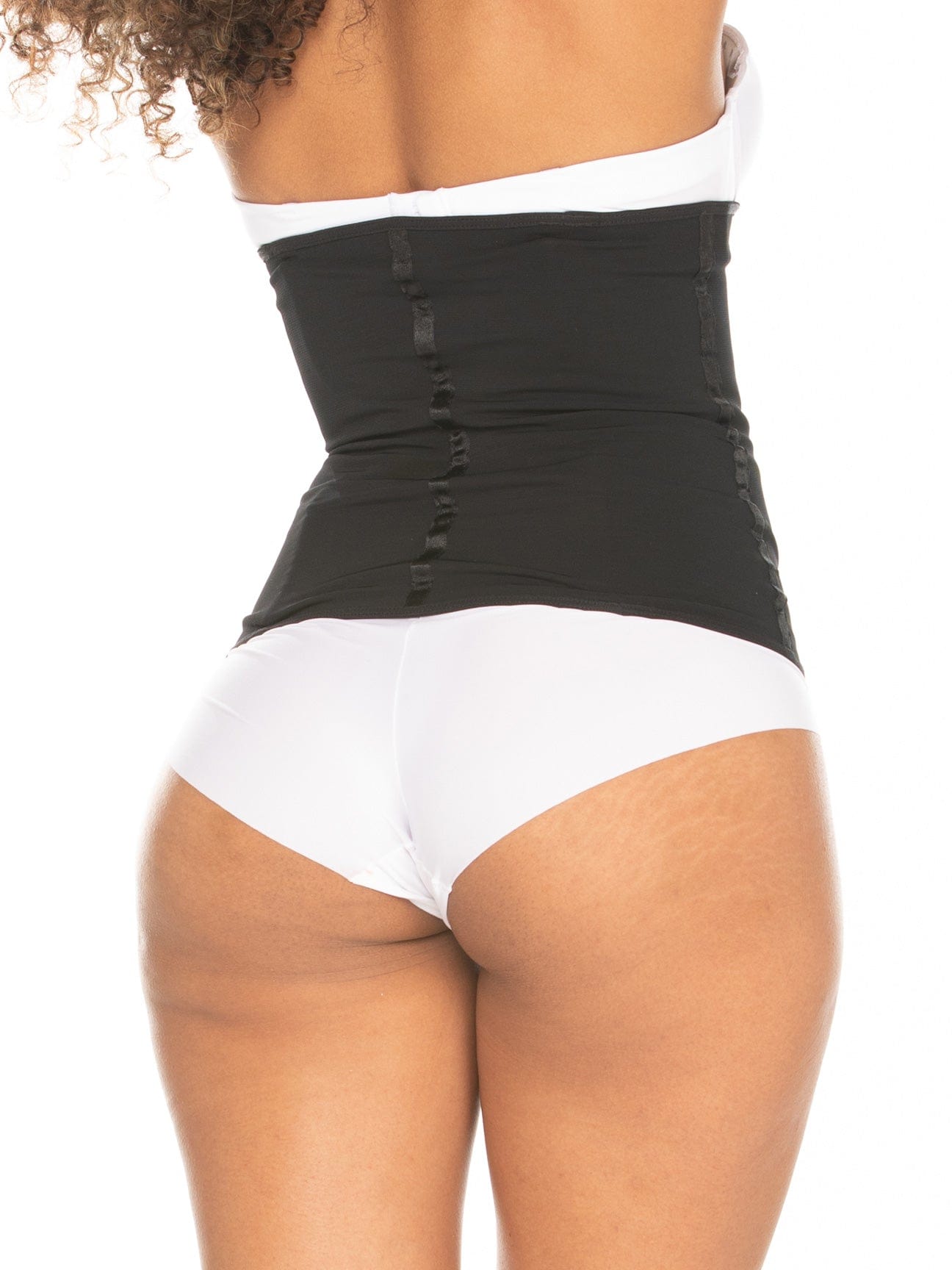 Back butt view of a model wearing a black strapless shapewear.