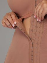 Mocha Colombian shapewear with adjustable hook-and-eye closure, close-up