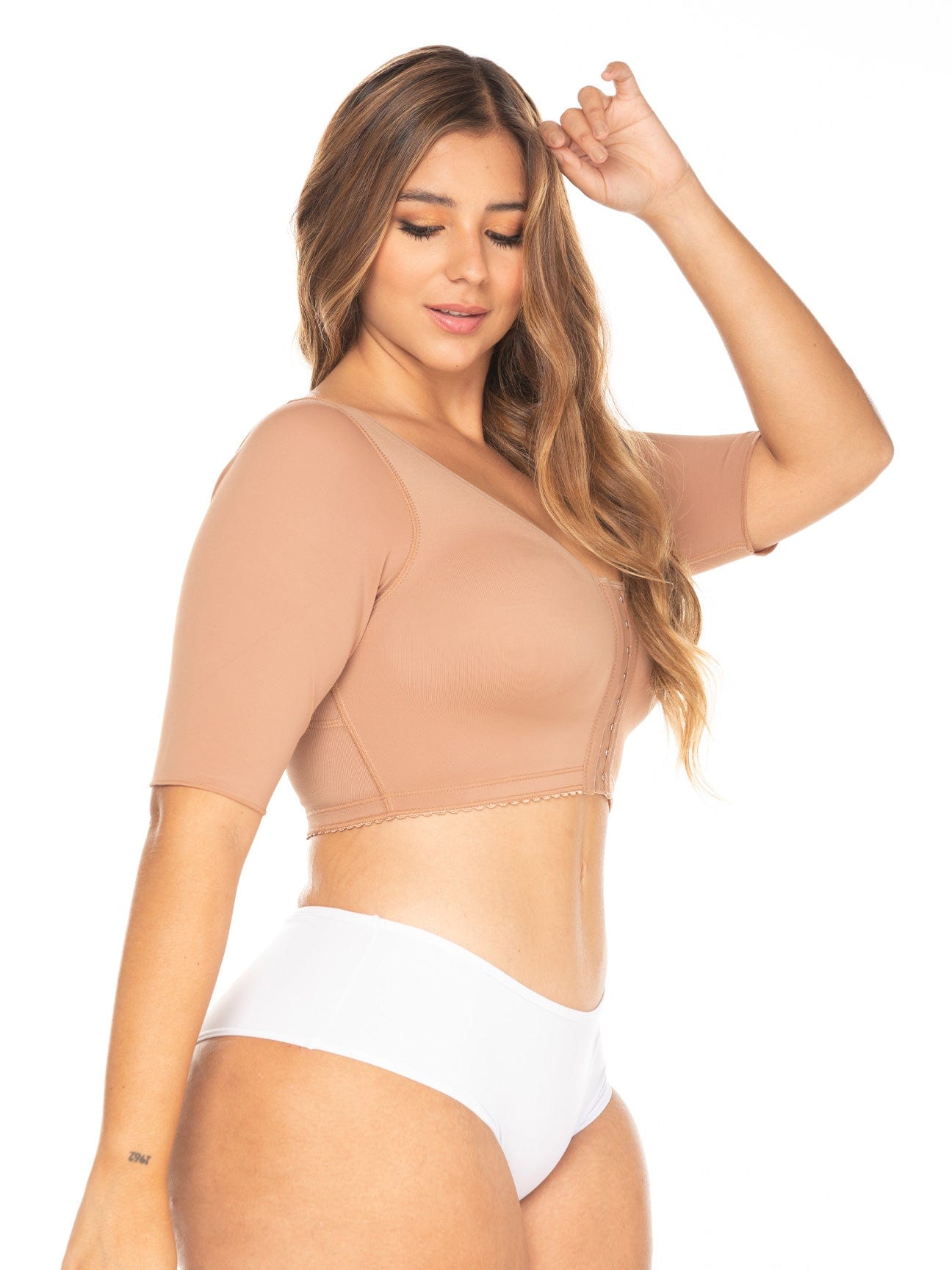 Mocha Colombian compression bra with hook-and-eye closure and sleeves for arm compression, side view